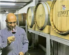  ?? — AFP ?? Taste test: Zumot sampling a wine at the Saint George winery in Zahab.