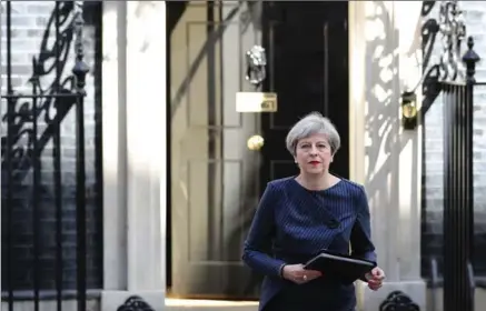  ?? DAN KITWOOD, GETTY IMAGES ?? Prime Minister Theresa May makes a statement to the nation in Downing Street on Tuesday in London, United Kingdom. The PM has called a general election for the United Kingdom to be held on June 8. The last election was held in 2015 with a Conservati­ve...