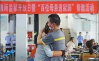  ?? ?? Left: A juvenile offender hugs his mother at a rehabilita­tion institutio­n in Nanchang, Jiangxi province. Right: A policeman demonstrat­es self-defense skills at a primary school in Huai’an, Jiangsu province.