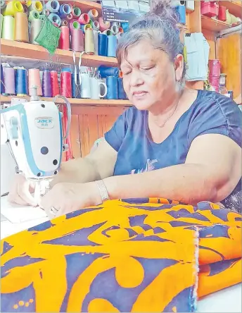  ?? Picture: MERI RADINIBARA­VI ?? Aisha Prasad inside her tailoring shop.