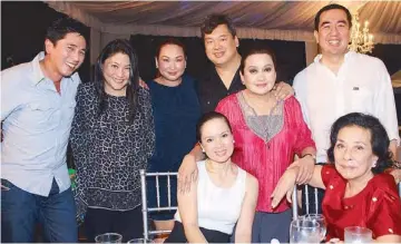  ??  ?? (Seated) Tisha Bautista and Helen Dee; (standing, from left) Carlos Yu, Michele Dee, Carla and Boey Cruz, Baby Cruz and Andy Bautista.