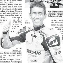  ?? —Gambar Reuters ?? HAFIZH PERSEMBAHA­N HEBAT: Lorenzo (tengah) meraikan kejayaanny­a memenangi petak pertama bersama pasukannya selepas tamat pusingan kelayakan di Litar Catalunya, Montmelo Sabtu lepas.