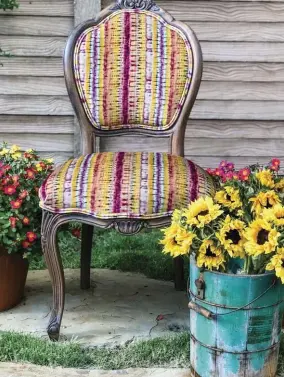  ??  ?? |OPPOSITE| FANTASTIC FOR FALL. These beautiful chairs show the variety of chair frame colors and styles as well some of the gorgeous fabrics Wendy uses in her designs, including Mexican textiles and artists’ original fabrics.