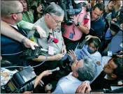  ?? ASSOCIATED PRESS ?? IN THIS JULY 14, 2006, FILE PHOTO, Elias Bermudez kneels before then-Sheriff Joe Arpaio at a protest over the lawman’s immigratio­n crackdowns. Bermudez, a former mayor of San Luis, Ariz., who led the pro-immigrant group Immigrants Without Borders, lost a bid Thursday to move his Sept. 5 trial on federal tax charges out of Phoenix. He has pleaded not guilty.