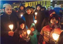  ?? RYAN REMIORZ/CANADIAN PRESS VIA AP ?? A vigil for Sunday’s shooting victims is held Monday in Quebec City at the Islamic Cultural Centre. Six people were killed and five wounded during the attack. A 27-year-old suspect is in custody.