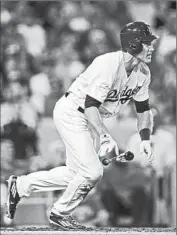  ?? Stephen Dunn Getty Images ?? CHASE UTLEY triples in the third to drive in Dodgers’ first run. He also scored go-ahead run in the sixth.