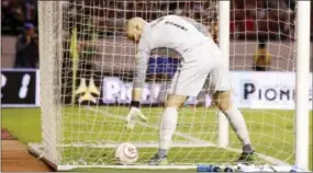  ?? MOISES CASTILLO — THE ASSOCIATED PRESS ?? United States goalkeeper Brad Guzan picks the ball out of the net after Joel Campbell scored Costa Rica’s fourth goal in Tuesday’s World Cup qualifying match.