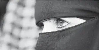  ?? David Vincent / Associated Press ?? A Saudi cleric has issued a ruling, or fatwa, saying it is permissibl­e for Muslim women to reveal their faces in countries where the Islamic veil is banned.