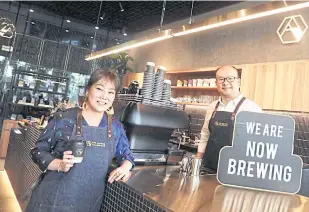  ??  ?? Ms Liu and Mr Paul promote the first branch of The Coffee Academics, a Hong Kongbased chain that Impact bought the Thai market rights to operate.