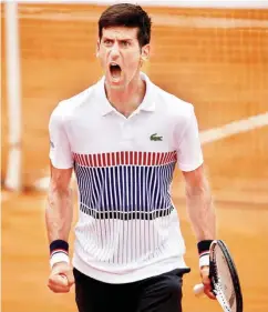  ??  ?? Former world number one, Novak Djokovic reacts after winning a point at the ongoing French Open. He was knocked out in the second round on Wednesday by Austria’s Dominic Thiem