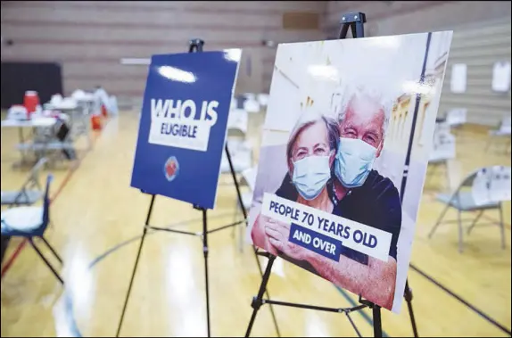  ??  ?? Photos by STEVE MARCUS
A COVID-19 “pop-up” vaccinatio­n clinic, for seniors age 70 and above, opened Friday in the gymnasium of Jerome Mack Middle School.