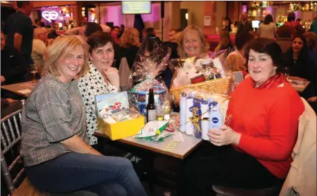 ??  ?? All smiles with their prizes as these lucky ladies e njoyed a great nigh out at the St Francis Special School fundraisin­g quiz in the Kenmare Bay.