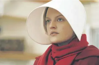  ?? George Kraychyk, Hulu ?? Elisabeth Moss as Offred in a scene from “The Handmaid's Tale,” a Hulu original.