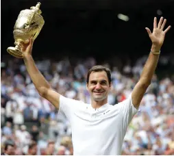  ?? (Reuters) ?? ROGER FEDERER is a Wimbledon champion for a men’s record eighth time, defeating Marin Cilic 6-3, 6-1, 6-4 in yesterday’s final. The win moves Federer past both Pete Sampras and William Renshaw, who each won seven titles at the grass-court major, for...