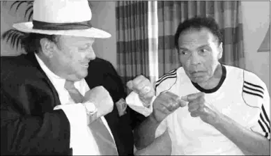  ?? PHOTO COURTESY OF HAPPY ALTER ?? Happy Alter, shown with Muhammad Ali, often talks of his time with the former boxing champ.
