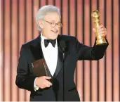  ?? ?? Steven Spielberg accepts the best director award for“The Fabelmans,”which also won best drama film at the Globes.