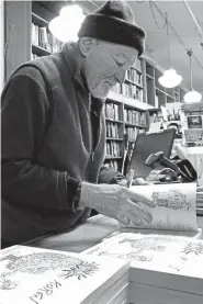  ?? Lisa Rathke, The Associated Press ?? Edward Koren, a longtime New Yorker magazine cartoonist, signs copies of his new book Nov. 29 at Bear Pond Books in Montpelier, Vt.