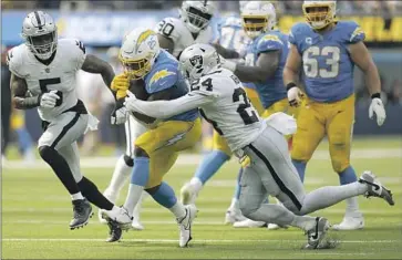  ?? Gregory Bull ?? JOSHUA KELLEY was the Chargers’ most efficient runner against the Raiders, but the team averaged just 2.5 yards per carry. Offensive coordinato­r Joe Lombardi said he would like to see “a little more consistenc­y.”