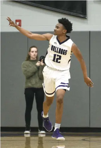  ?? NWA Democrat-Gazette/Charlie Kaijo ?? Fayettevil­le guard Corey Williams, Jr (12) reacts after a score during a basketball game, Friday, January 10, 2020 at Fayettevil­le. Williams will lead the Purple’Dogs into the 2020-21 season as one of the top guards in the 6A-West Conference.