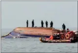  ?? VIA AGENCE FRANCE-PRESSE ?? Members of the coast guard search for missing people after a fishing boat crashed with a fuel tanker near Incheon, South Korea, on Sunday.