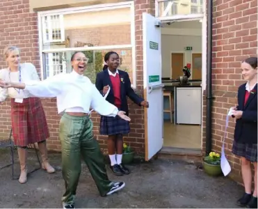  ?? ?? OPEN TIME: Former pupil Afiya Titus returned to Queen Anne’s School to cut the ribbon and officially unveil the new culinary facility – and she helped Year 9 students get wise in the kitchen Picture: Courtesy of Queen Anne’s