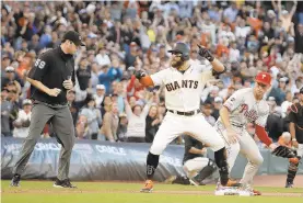  ?? BEN MARGOT/AP ?? The Giants’ Kevin Pillar reacts after hitting an RBI triple in the eighth inning off Phillies reliever Nick Pivetta, not pictured, on Sunday night in San Francisco.