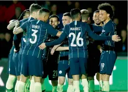  ?? — AP ?? Manchester City players celebrate their 4-1 win over Newport County in their FA Cup fifth round match at the Rodney Parade Stadium on Saturday.