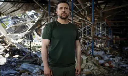  ?? ?? Ukraine’s President Zelenskiy stands inside a destroyed printworks during his appeal to Joe Biden and Xi Jinping. Photograph: Ukrainian Presidenti­al Press Service/Reuters