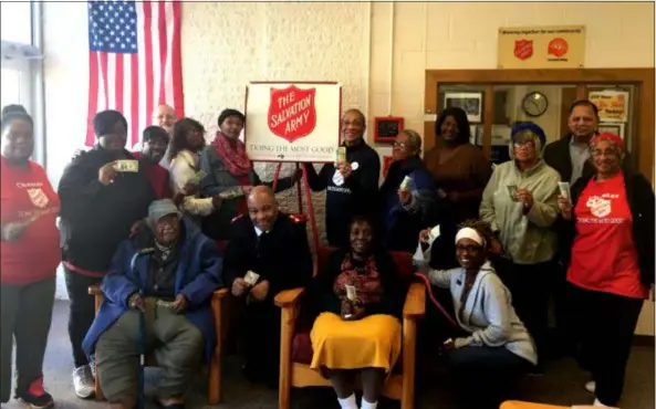  ?? COLIN AINSWORTH - DIGITAL FIRST MEDIA ?? The Forever Young senior citizens group joins Major Ervin McKoy and members of the Salvation Army Chester Corps advisory board to launch the 2018 Kettle Drive and Merry Christmas Fund.