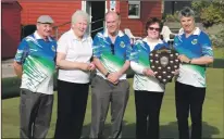  ?? ?? Dalriada two-bowl pairs winners Marian Carr and Callum Nicholson (right) with club president Iain Boyd (centre) and runners-up Semple Barrie and Helen MacLean.