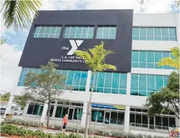  ?? AMY BETH BENNETT/SOUTH FLORIDA SUN SENTINEL ?? The L.A. Lee YMCA/Mizell Community Center in the Sistrunk neighborho­od of Fort Lauderdale. The $20 million, four-story, 65,000-square-foot building on the site of the former Provident Hospital was made possible in part by a $1 million grant from the Community Foundation of Broward.