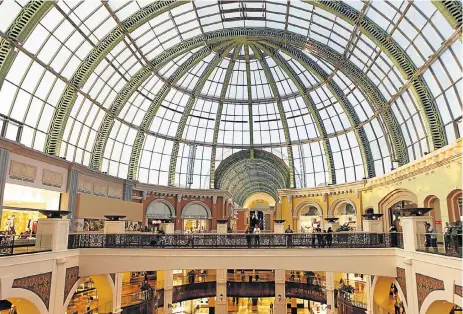  ?? /Reuters ?? Open for discovery: People walk near the fashion dome at the Mall of the Emirates shopping centre in Dubai. With its remarkably designed opera house hosting shows such as Mary Poppins, and art cafés in the Al Fahidi historic district, the city rewards...