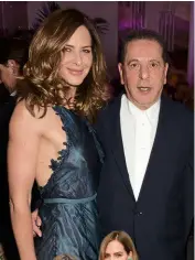  ??  ?? BELOW: With her boyfriend Charles Saatchi. BOTTOM: Trinny and her partner on What Not To Wear, Susannah Constantin­e.