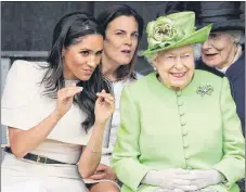  ?? AP PHOTO ?? Britain’s Queen Elizabeth and Meghan, the Duchess of Sussex, left, attend the opening of the new Mersey Gateway Bridge, in Widnes, England on Thursday.