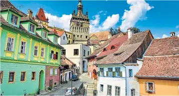  ??  ?? g Jewel in the crown: The city of Sighisoara in Transylvan­ia is a colourful highlight of the Romanian cycle adventure