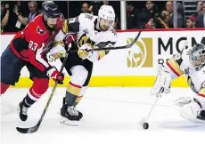  ?? ALEX BRANDON/THE ASSOCIATED PRESS ?? Washington Capitals forward Jay Beagle is all over Vegas Golden Knights defenceman Shea Theodore as he tries to move the puck during Game 3 action in the Stanley Cup final. The Caps’ ‘team-defence’ mantra has stifled the Vegas offence so far.