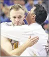  ?? MARK J. TERRILL / AP ?? UCLA senior guard Bryce Alford (left) hugs his father, coach Steve Alford. The Bruins face Cincinnati today in the NCAA Tournament.