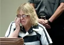  ?? Rob Fountain/Reuters ?? Joyce Mitchell reacts as she appears to plead guilty Tuesday at Clinton County Court, in Plattsburg­h, N.Y.