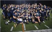  ?? AUSTIN HERTZOG - MEDIANEWS GROUP ?? The Spring-Ford football team poses with the PAC championsh­ip plaque after defeating Pope John Paul II in the championsh­ip game Friday night.