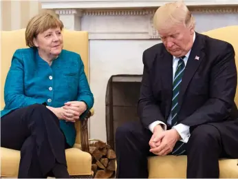  ??  ?? First meeting: Donald Trump and Angela Merkel in the Oval Office yesterday