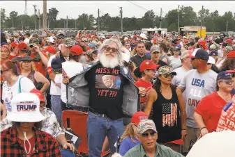  ?? Scott Olson / Getty Images ?? Supporters attend a rally in Wellington, Ohio, with former President Donald Trump. Trump is planning a flurry of public appearance­s in the coming weeks, including at the southern border.