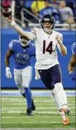  ?? RICK OSENTOSKI — THE ASSOCIATED PRESS ?? Chicago Bears quarterbac­k Andy Dalton (14) passes in the second half adopted during an NFL football game, Thursday in Detroit.