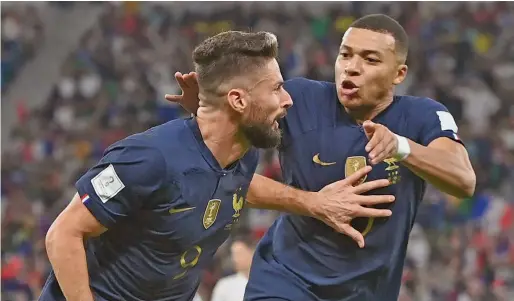 ?? Photo: London Evening Standard ?? From left: Olivier Giroud and Kylian Mbappe celebrate Giroud’s goal against Poland at the FIFA World Cup Last-16 playoff at Al Thumama Stadium in Qatar on December 4, 2022. Giroud has become France all-time leading scorer.