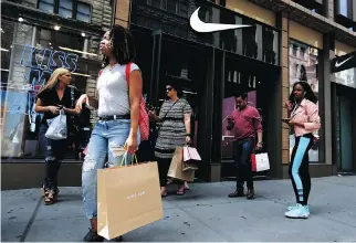  ?? MICHAEL NOBLE JR./AP FILES ?? Nike Inc. is targeting the fitness and wellness trend popular with women by focusing on developing and revamping styles for workouts and leisure. It plans to sell the new stylish sportswear in stores starting Nov. 1, challengin­g Lululemon, which helped...