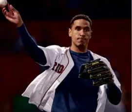  ?? JIM DAVIS/GLOBE STAFF ?? Malcolm Brogdon got into the swing of things by throwing out the ceremonial first pitch at Fenway Park Wednesday.