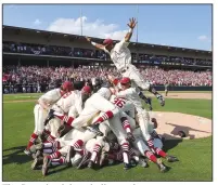  ?? (File Photo/J.T. Wampler) ?? The Razorback baseball squad celebrates advancing to the College World Series in Omaha in 2015. This weekend, fans can relive one of the most memorable SEC Tournament games that year, the Razorbacks vs. the Florida Gators.