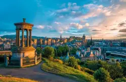  ??  ?? CALTON HILL AT SUNSET The 19th-century Dugald Stewart Monument offers a stunning view of central Edinburgh.