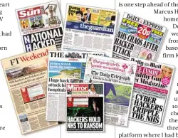  ??  ?? BELOW Dramatic headlines in the British newspapers reflected the scale of the attack’s effect on the NHS