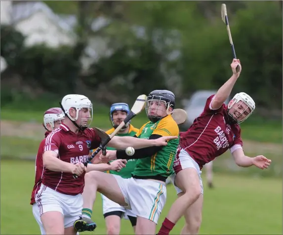  ??  ?? Freemount’s Denis Curtin and Dean Collins in a tangle with Barry O’Flynn(Millstreet) during the Kanturk Co-Op Mart Duhhallow JAHC in Kilbrin. Picture John Tarrant