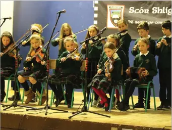  ??  ?? Musicians from Gaelscoil Chnoc na Ré performing during the Scór na bPáistí finals.